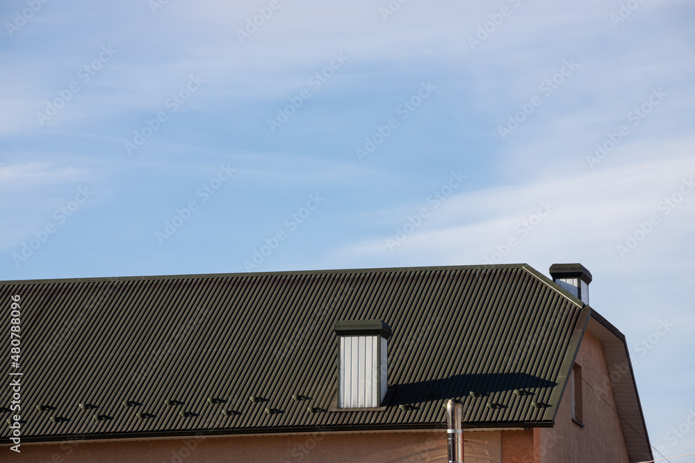 New roofing construction with attic skylights, rain gutter system, roof windows and roof protection from snow board, snow guard exterior New roofing construction with attic skylights, rain gutter system, roof windows and roof protection from snow board, snow guard exterior