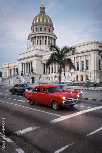 Old car on streets of Havana with Capitolio building in background. Cuba © danmir12