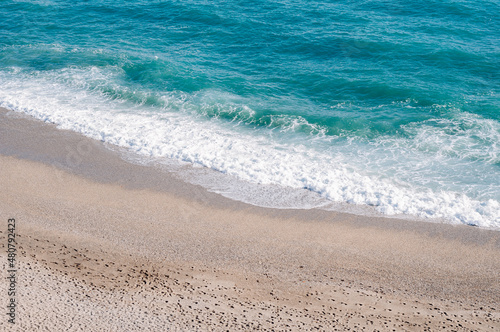 Beautiful beach, small grains of sand and blu waves