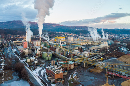 Aerial view of a huge paper factory facility in Austria during sunset Fototapete