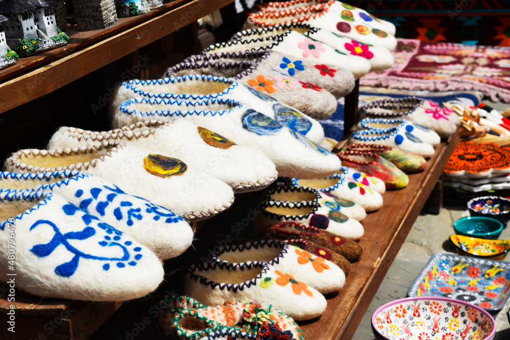 Hand-woven slippers with various color patterns at the Turkish bazaar in Gjirokastra, Albania