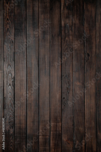 Background from boards of deep brown color for design, menus, advertising booklets. Beautiful texture. Free space for text.