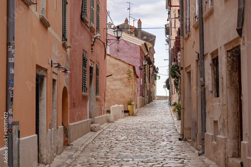 Empty, old, stone paved narrow streets of Rovinj, popular tourist destination with beautiful, colorful houses in the Istrian region of Croatia © Miroslav Posavec