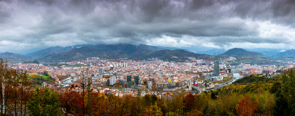 Stunning evening aerial view of autumn Bilbao at rainy weather from Artxanda hill, Basque country, Spain.