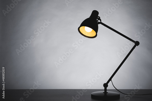 Принти на полотні desk lamp silhouette, gray background with copy-space
