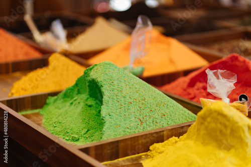 counter with colorful and aromatic oriental spices on the market. 