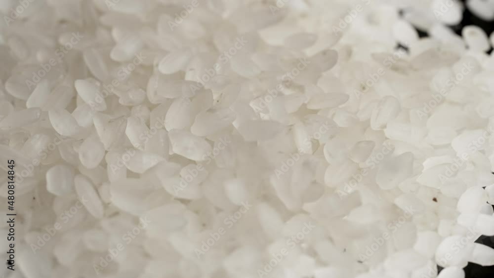 Macro shot of pouring rice slow motion Macro shot of pouring rice slow motion