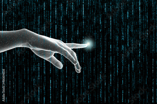 Metaverse concept. A human hand or ai hand reaches out touching matrix like lines of vertical code. photo