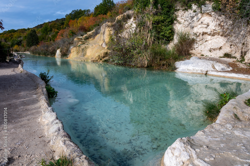Fototapeta premium Ancient hot thermal springs and blue pool in nature park Dei Mulini, Bagno Vignoni, Tuscany, Italy