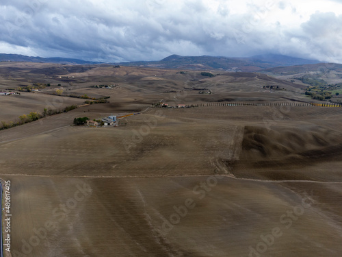 Aerial view on hills of Val d Orcia  Tuscany  Italy. Tuscan landscape with ploughed fields in autumn.