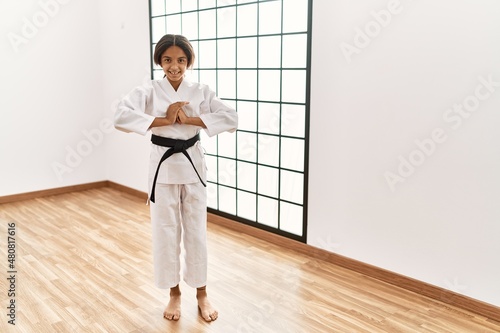 African american girl wearing kimono training karate at sport center