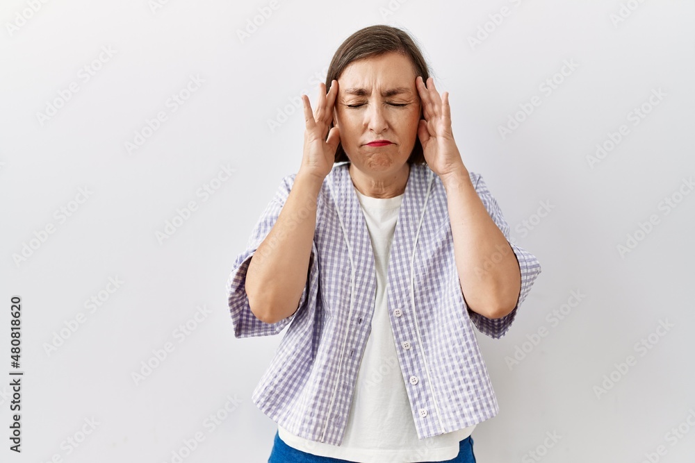 Beautiful middle age hispanic woman standing over isolated background showing middle finger, impolite and rude fuck off expression Beautiful middle age hispanic woman standing over isolated background showing middle finger, impolite and rude fuck off expression