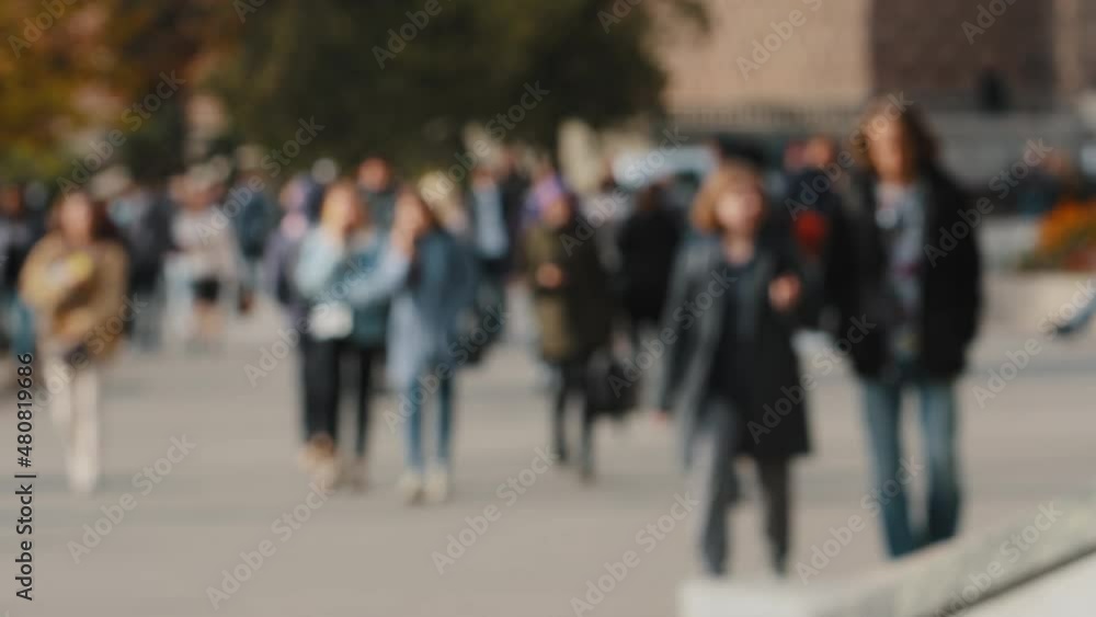 Managers, students, office staff and business people commute to work in morning on foot. Pedestrians, men and women on city street, sidewalk, square. Diverse people walking in downtown. Soft focus