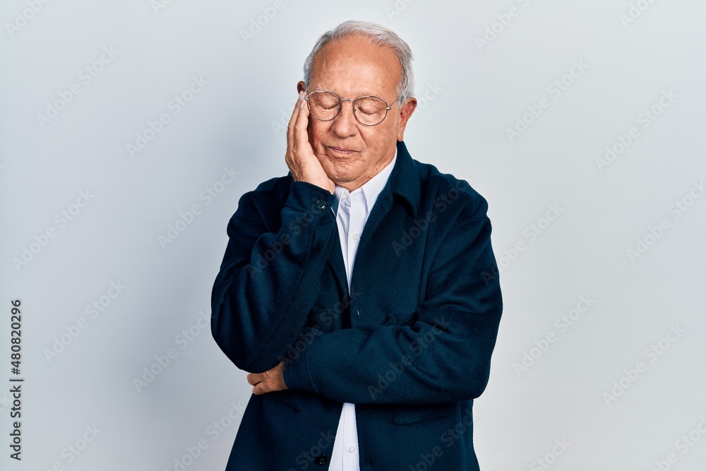 Senior man with grey hair wearing casual style and glasses thinking looking tired and bored with depression problems with crossed arms. Senior man with grey hair wearing casual style and glasses thinking looking tired and bored with depression problems with crossed arms.