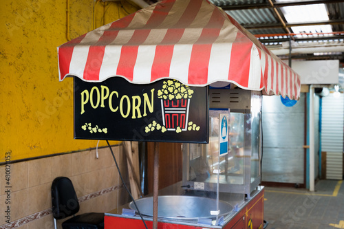 Old popcorn stall at empty market. Pandemic crisis, business lockdown concept, vintage style