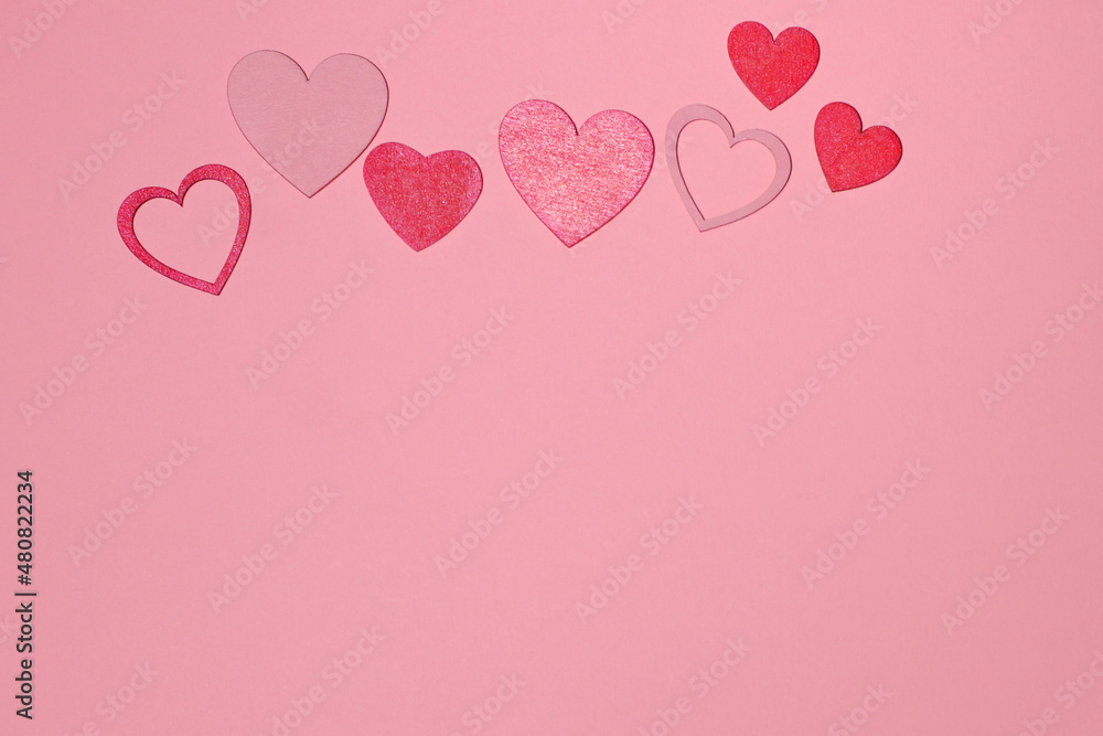 Red hearts on pink background, love card