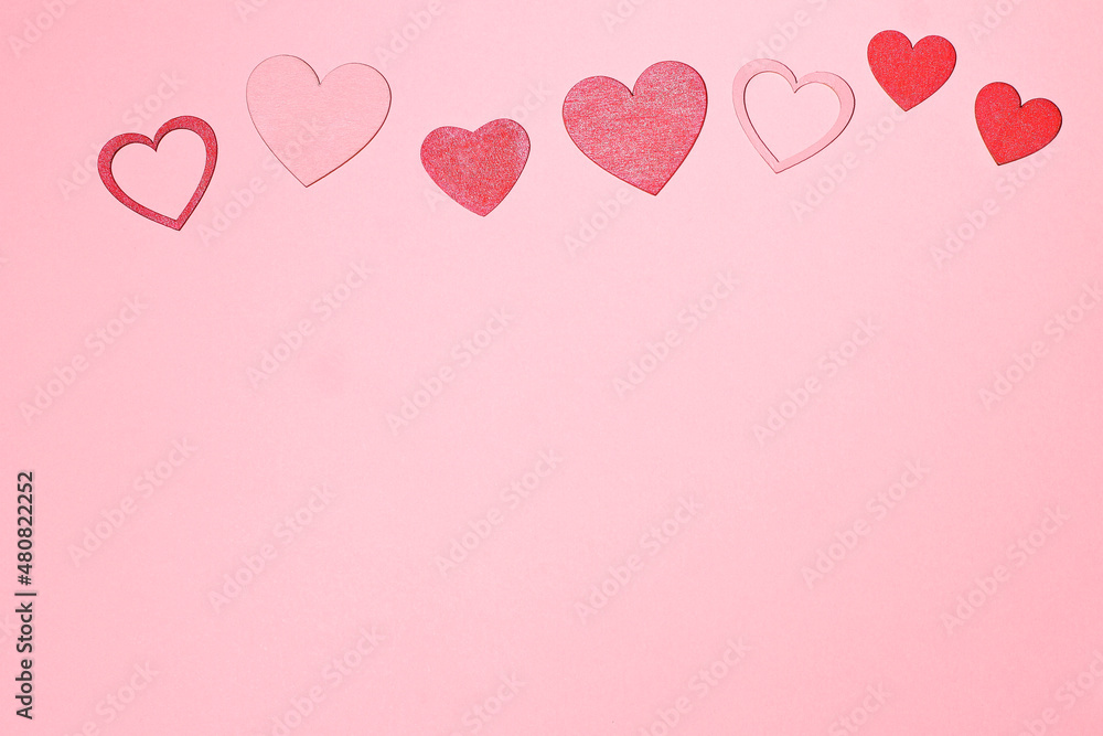 Red hearts on pink background, love card