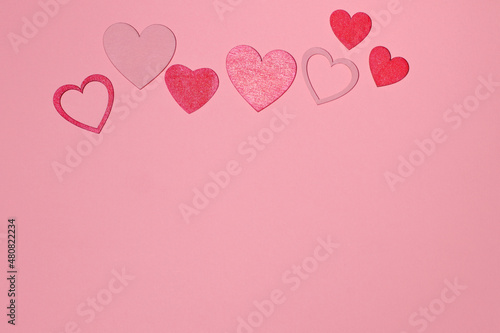 Red hearts on pink background  love card