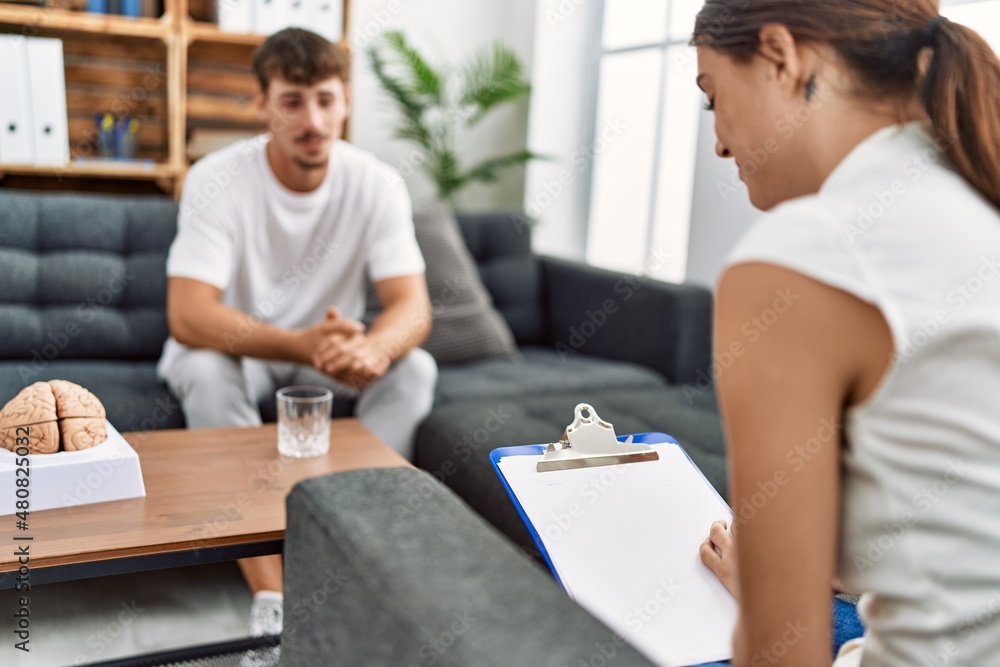 Man and woman having pshychology session at psychology center