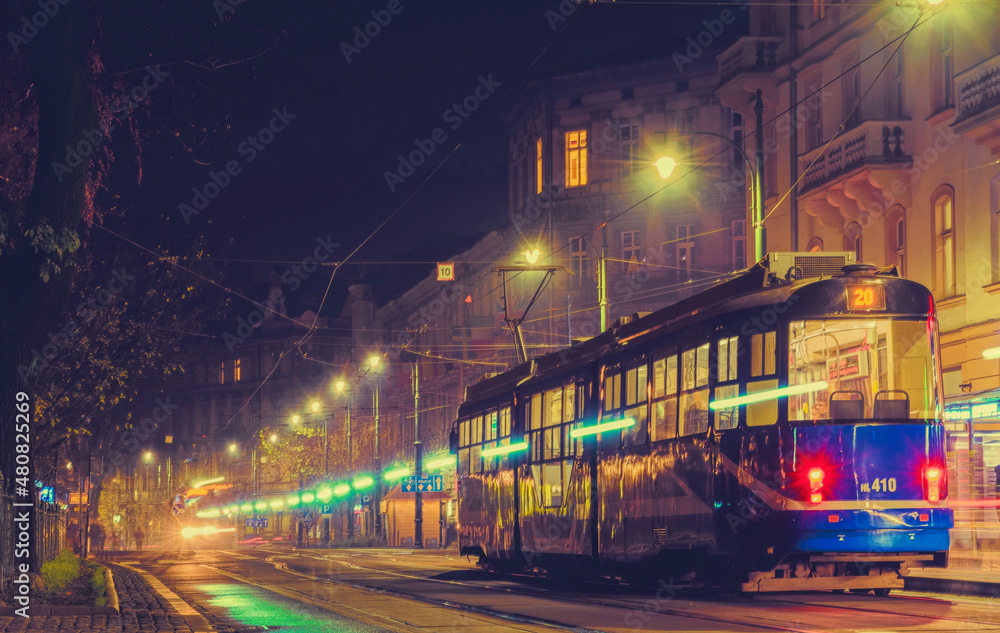 Shining tram on the night street of the old city