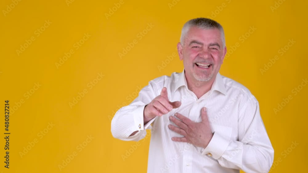 Cheerful elderly man laughing and pointing at you by forefingers. Funny grandpa lifestyle moments Cheerful elderly man laughing and pointing at you by forefingers. Funny grandpa lifestyle moments