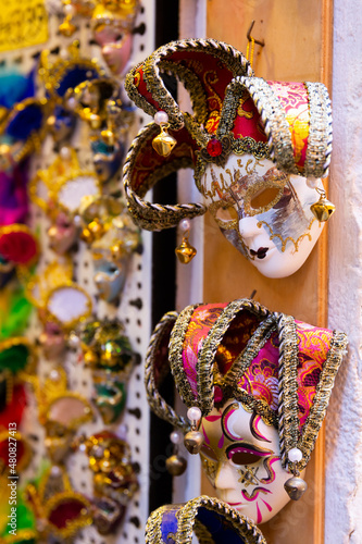 Traditional souvenir market in Venice offering large assortment of handmade colorful masks to remember your trip