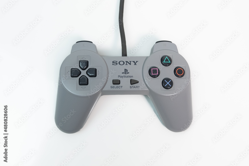 Foto Stock Sony PlayStation 1 controller for original PS1 console. Top down  on white background. | Adobe Stock