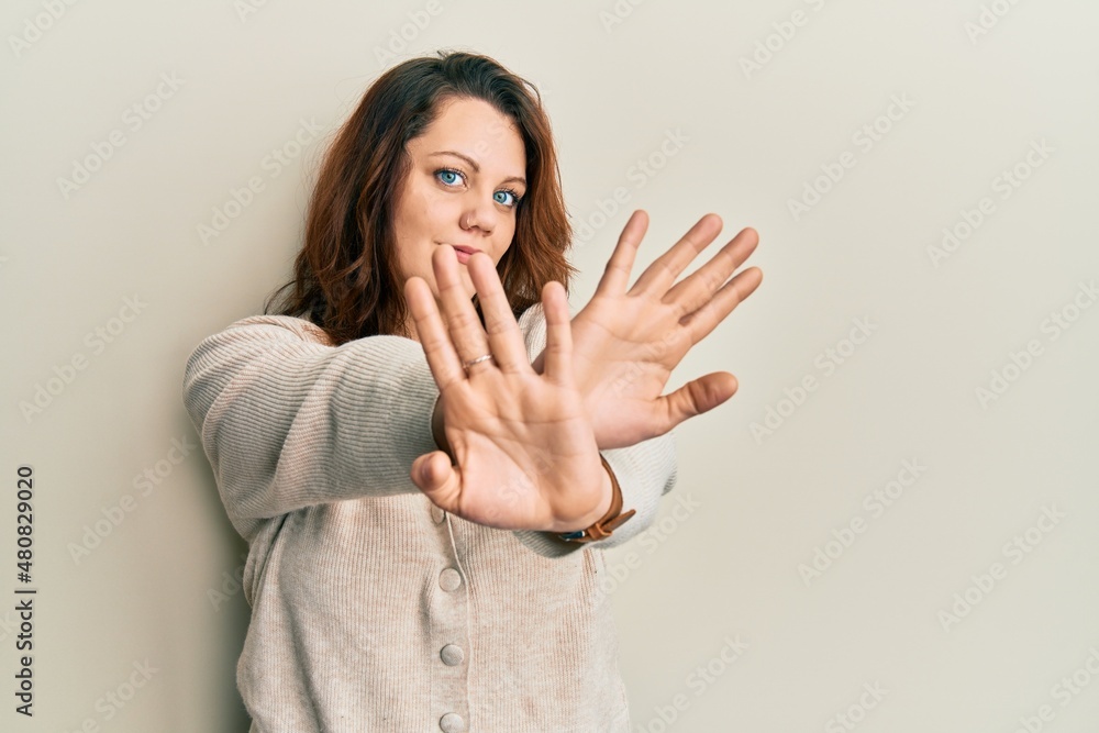Young caucasian woman wearing casual clothes rejection expression crossing arms and palms doing negative sign, angry face Young caucasian woman wearing casual clothes rejection expression crossing arms and palms doing negative sign, angry face