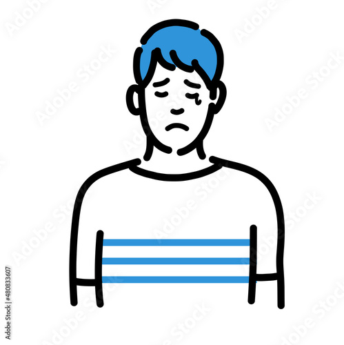 悲しそうに涙を流している若い男性