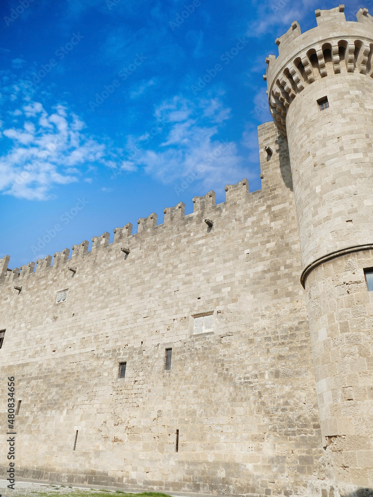 Massive medieval walls and towers guard  Palace of the Grand Master