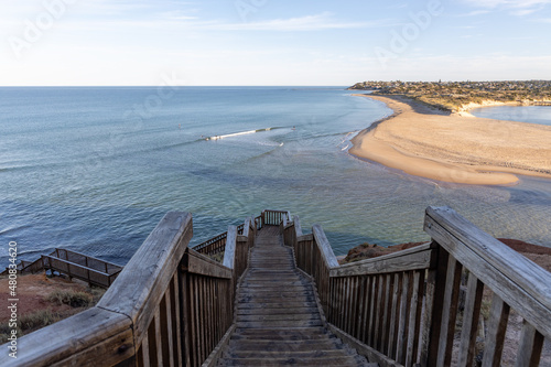 Sunrise over iconic stairs at southport lcoated in port noarlunga  south australia on january 16th 2022