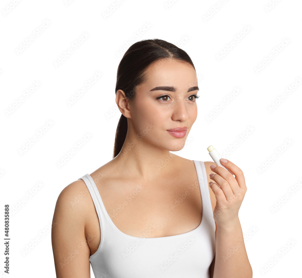 Young woman with lip balm on white background Young woman with lip balm on white background