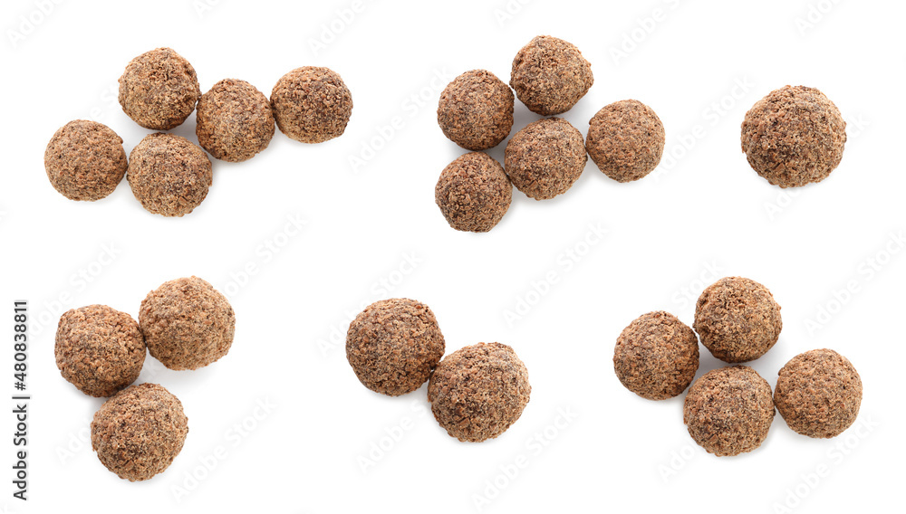 Set with delicious sweet chocolate truffles on white background, top view Set with delicious sweet chocolate truffles on white background, top view