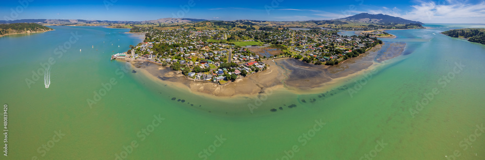 Aerial drone panoramic view over the seaside town of Raglan, on the West Coast of the Waikato region in the North Island of New Zealand.