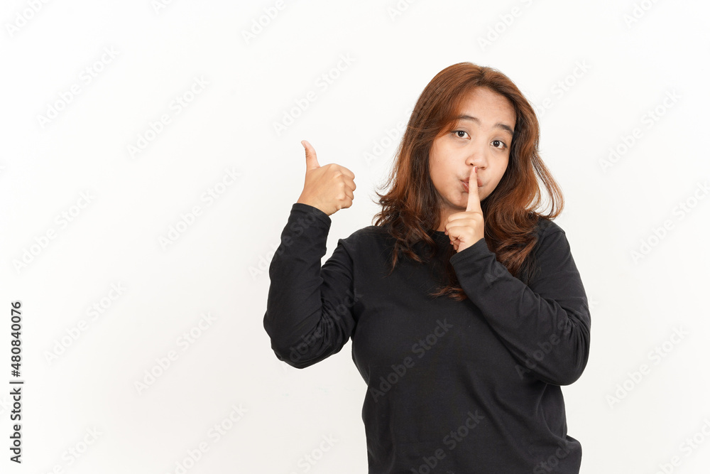 Pointing product with thumb Of Beautiful Asian Woman Wearing Black Shirt Isolated On White Pointing product with thumb Of Beautiful Asian Woman Wearing Black Shirt Isolated On White
