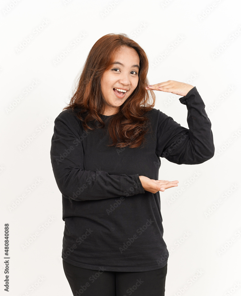 Showing big size sign or product Of Beautiful Asian Woman Wearing Black Shirt Isolated On White Showing big size sign or product Of Beautiful Asian Woman Wearing Black Shirt Isolated On White