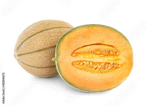 Whole and cut tasty ripe melons on white background