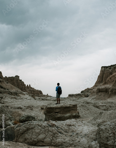 STANDING AMIDST ROCK FORMATION