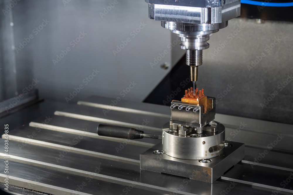 The CNC milling machine cutting the copper electrode parts with solid ball end mill tools. The CNC milling machine cutting the copper electrode parts with solid ball end mill tools.