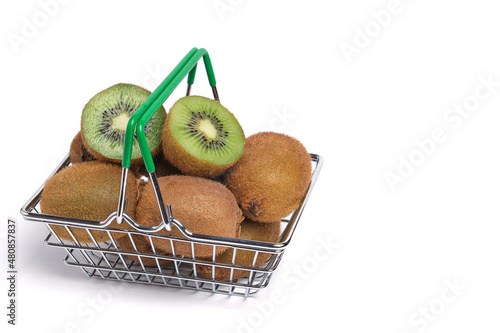 Kiwi fruit in shopping basket on white background, isolate.