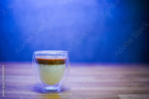 dirty coffee. the cappuccino shot on chilled milk. cold milk coffee. front view.