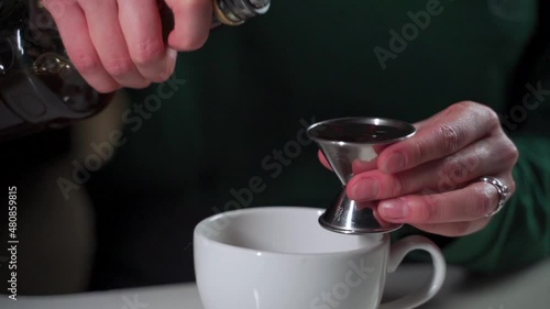 Barista Pouring Syrup for Latte photo