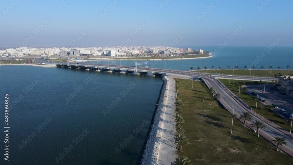 Bridge in Persian Gulf on sunny day, Tarout Island in background. Aerial descending Bridge in Persian Gulf on sunny day, Tarout Island in background. Aerial descending