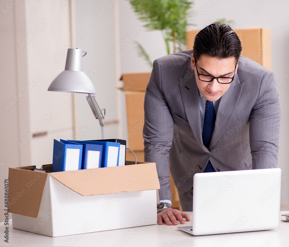 Young handsome businessman moving offices Young handsome businessman moving offices