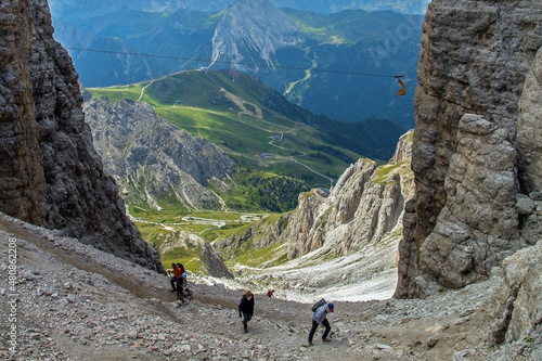 Hikers in Focella Pordoi on Sella Group Dolomite, Trentino, Italy photo