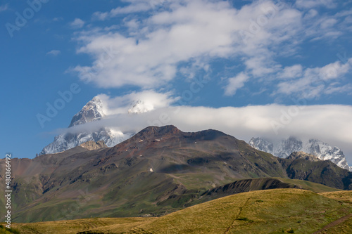 A panoramic view on the Ushba mountain peaks near Mestia in the Greater Caucasus Mountain Range, Upper Svaneti, Country of Georgia. Hiking trail to the Koruldi Lakes. Wanderlust, trekking.