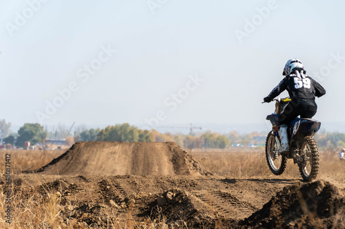 Fototapeta Naklejka Na Ścianę i Meble -  jumping on a motorcycle. motocross. motorcycle racing. bikers on the track