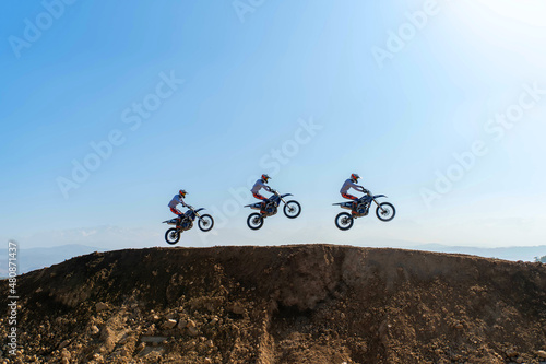 jumping on a motorcycle. motocross. motorcycle racing. bikers on the track