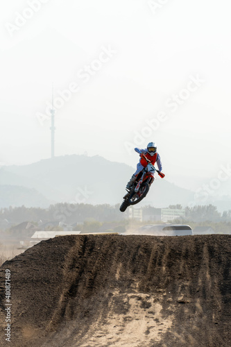 jumping on a motorcycle. motocross. motorcycle racing. bikers on the track