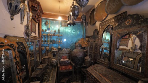 footage of display selling handmade carvings made of wood, glass and metal from Morocco